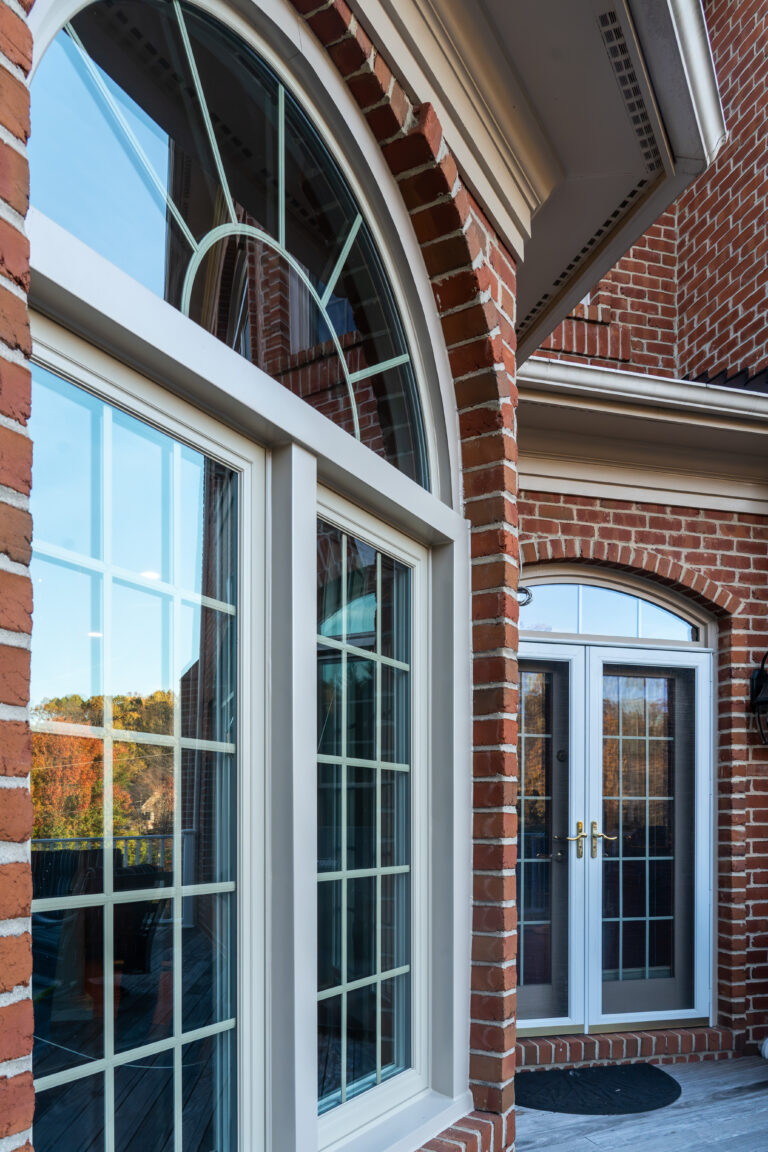 Fortis Beige with arch, brick home