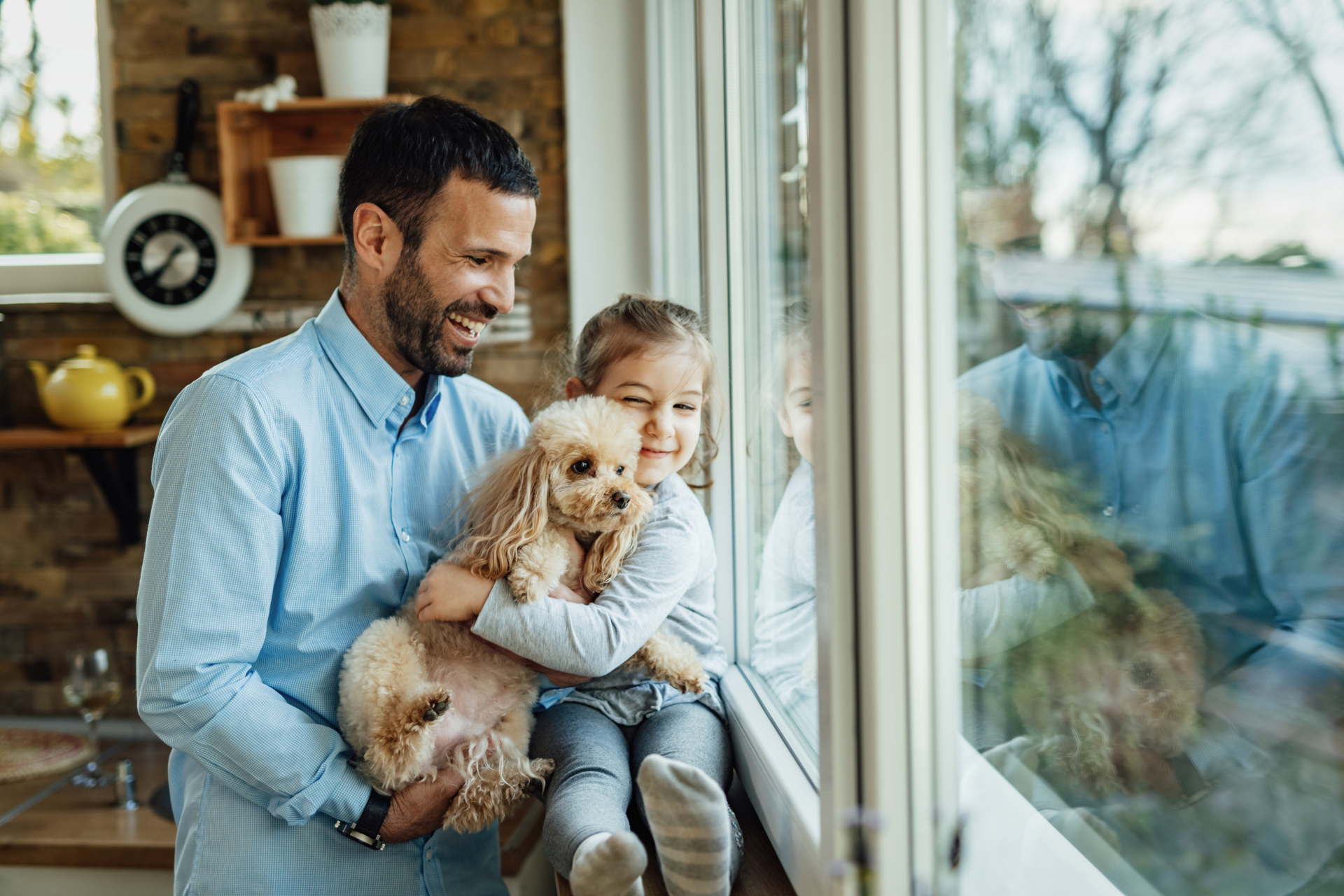Dad, daughter and dog looking out window. Click to learn more about the Vytex Warranty